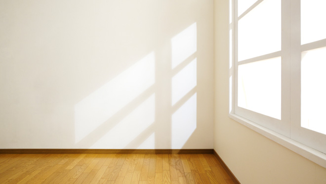 Image of bright sunlight shining into empty office space